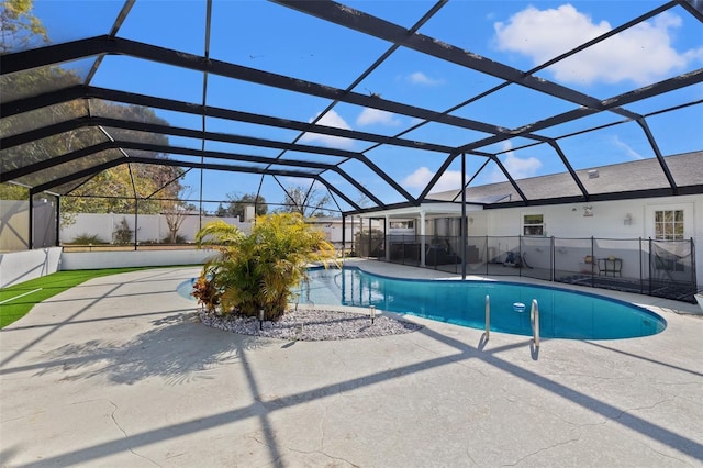 view of pool with a lanai and a patio area