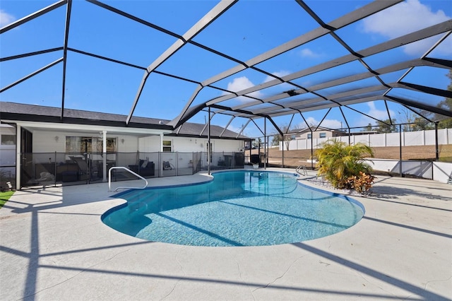 view of swimming pool with a patio area and glass enclosure