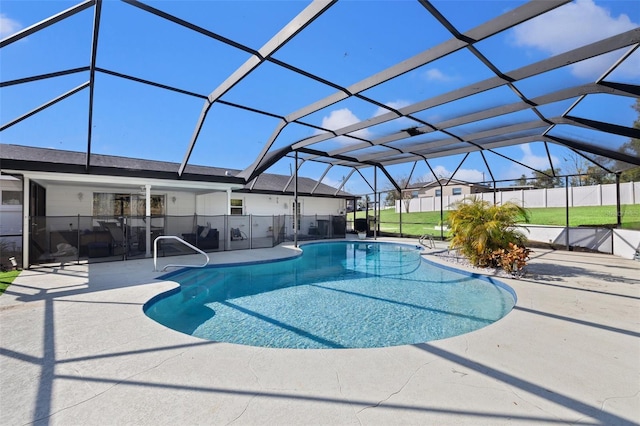 view of swimming pool featuring a patio and glass enclosure