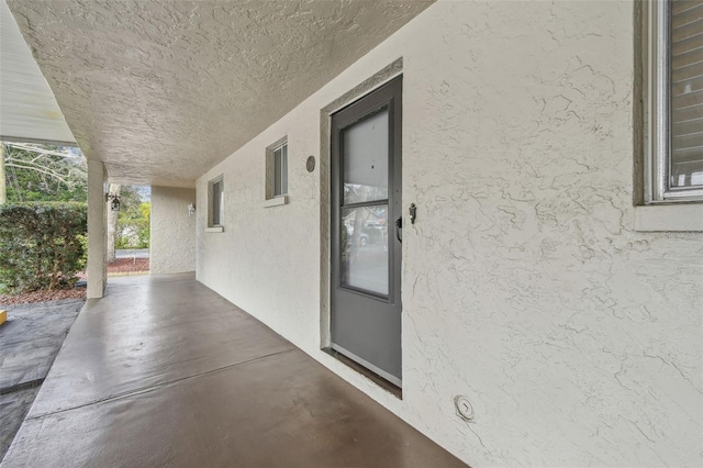 property entrance with a patio