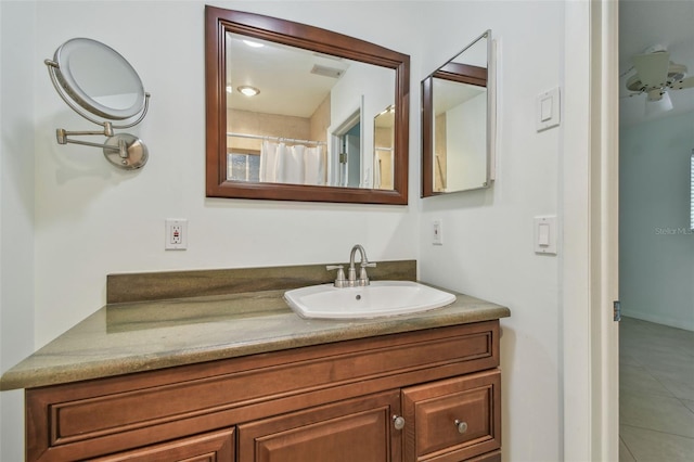 bathroom featuring tile patterned floors and vanity