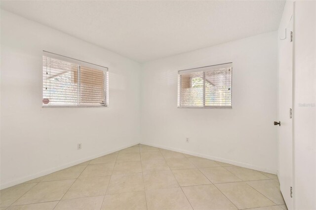 view of tiled spare room