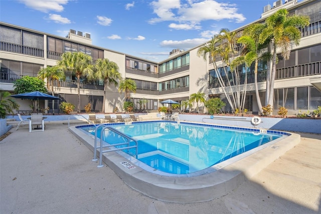 view of swimming pool featuring a patio area