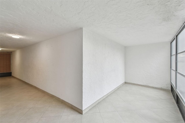 corridor featuring a textured ceiling