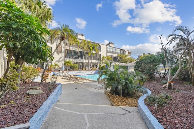 view of community with a patio area and a pool