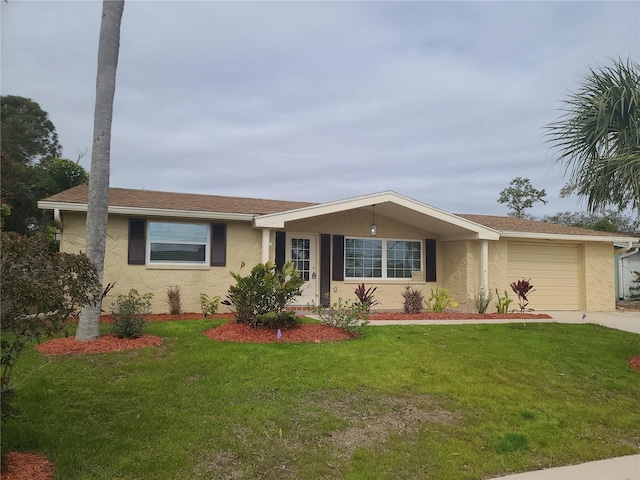 ranch-style home featuring a garage and a front lawn