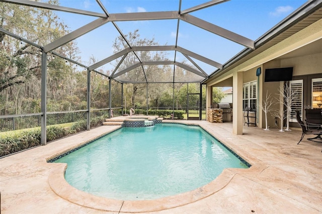 view of swimming pool with a patio area and a pool with connected hot tub