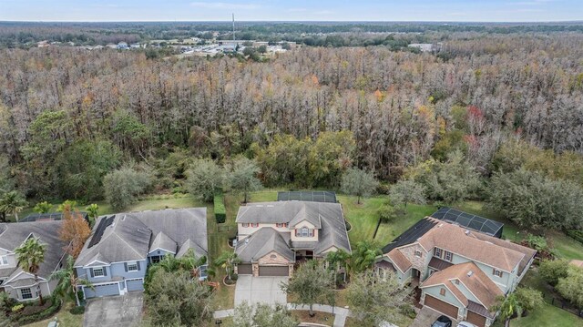 aerial view featuring a residential view and a view of trees