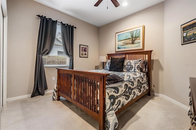 bedroom featuring carpet floors, baseboards, and a ceiling fan