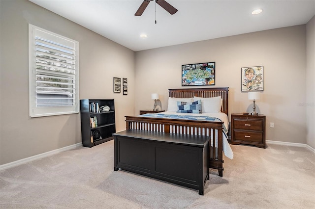 bedroom featuring baseboards, recessed lighting, and light colored carpet