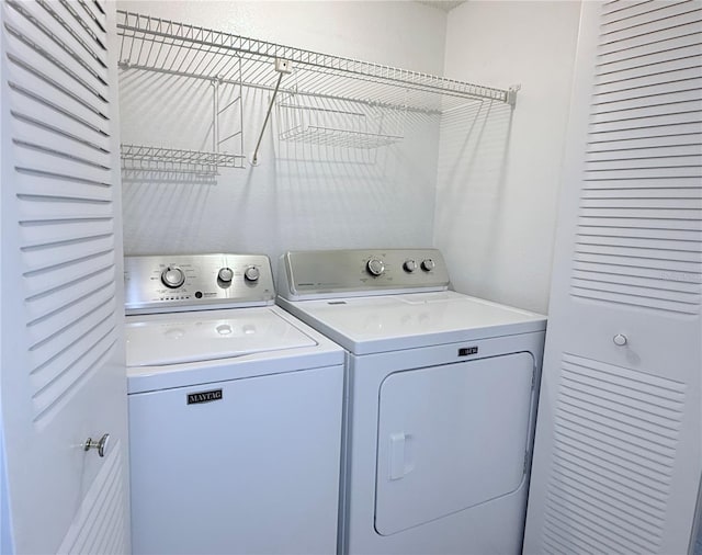 laundry area with independent washer and dryer