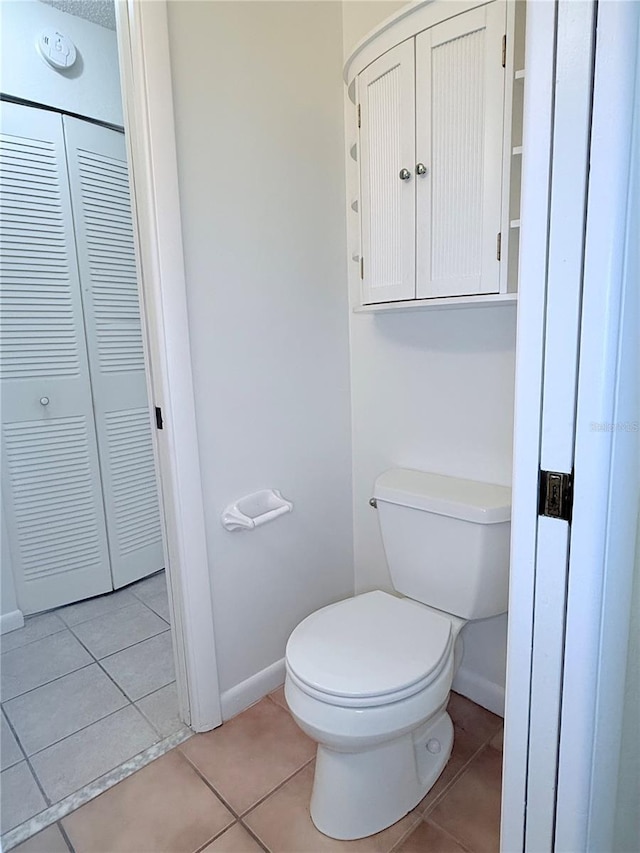 bathroom featuring tile patterned floors and toilet