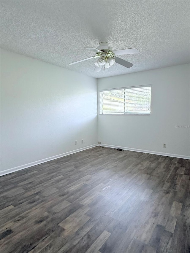 unfurnished room with dark hardwood / wood-style flooring, ceiling fan, and a textured ceiling