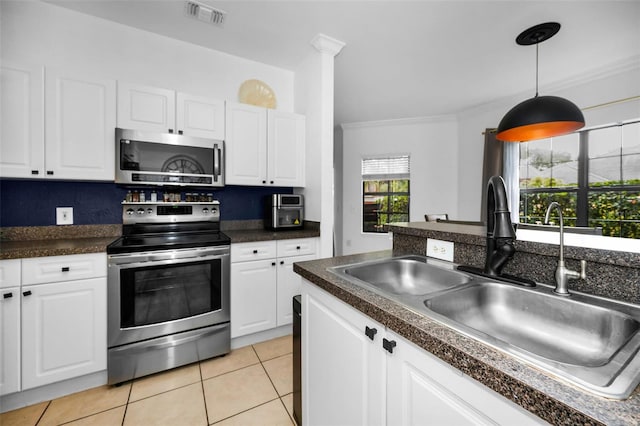 kitchen featuring white cabinetry, stainless steel appliances, and sink