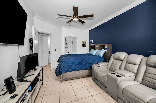 tiled bedroom with ornamental molding and ceiling fan