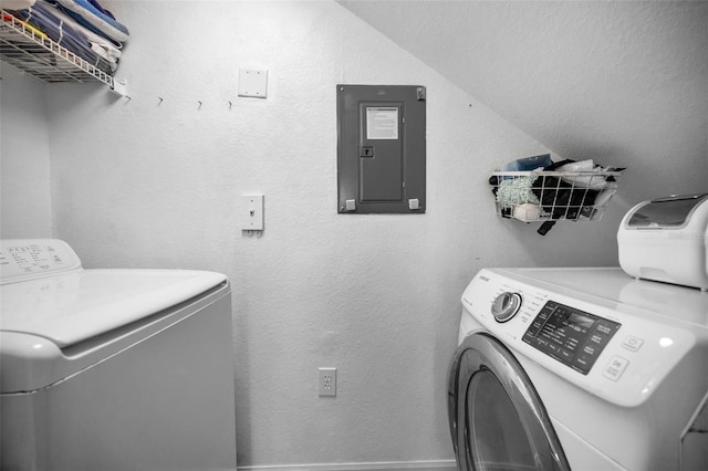 laundry area with washing machine and clothes dryer and electric panel