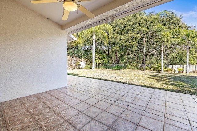 view of patio / terrace featuring fence and a ceiling fan