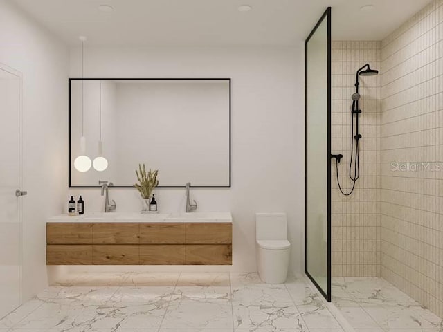 bathroom featuring tiled shower, vanity, and toilet