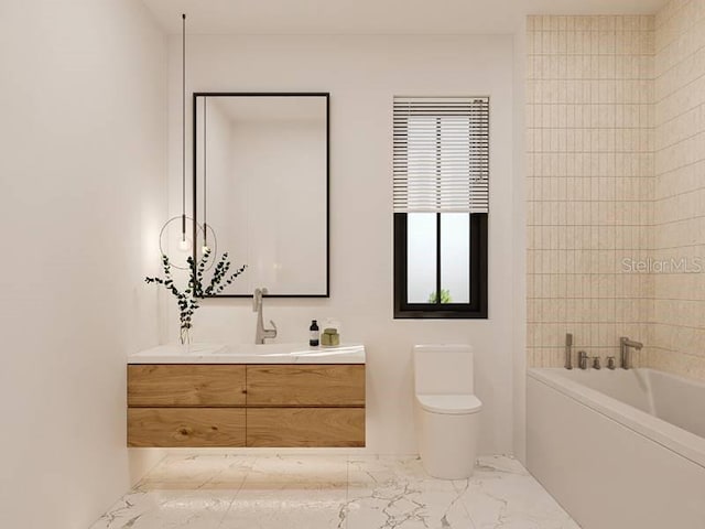 bathroom featuring a washtub, vanity, and toilet