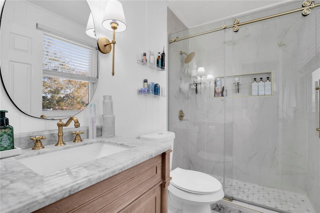 full bath with a marble finish shower, toilet, and vanity