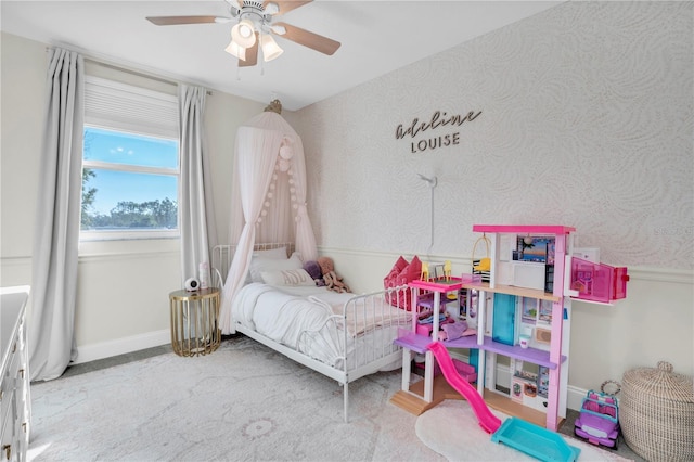 bedroom featuring baseboards, ceiling fan, and wallpapered walls