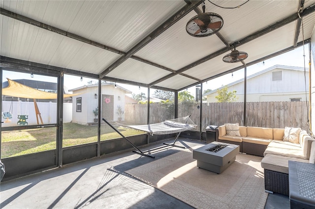 sunroom featuring vaulted ceiling