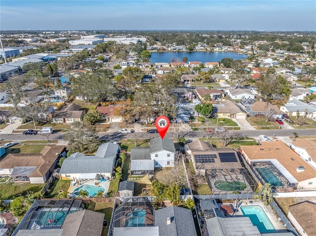 bird's eye view featuring a water view and a residential view