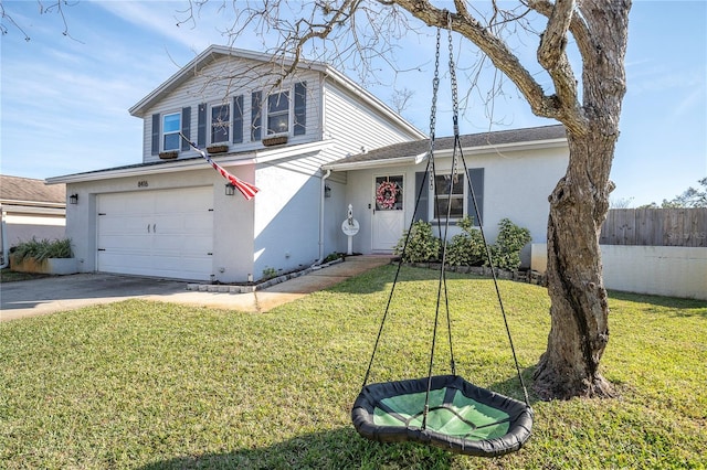 traditional-style home with fence, concrete driveway, a front yard, stucco siding, and an attached garage