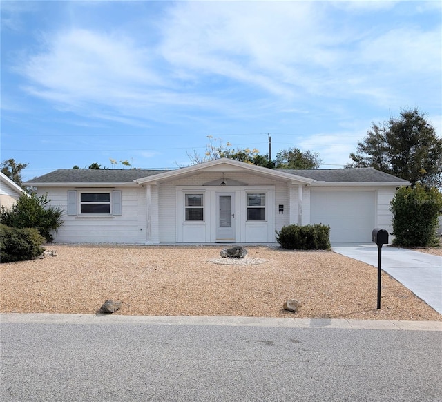 ranch-style house featuring a garage