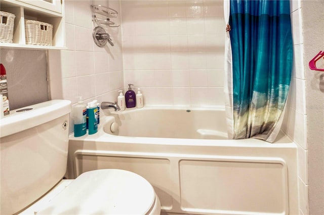 bathroom featuring shower / bath combo, tile walls, and toilet