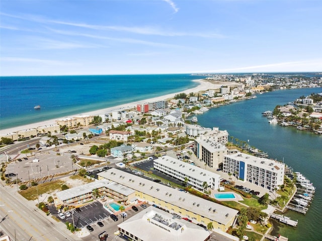 bird's eye view with a water view and a beach view