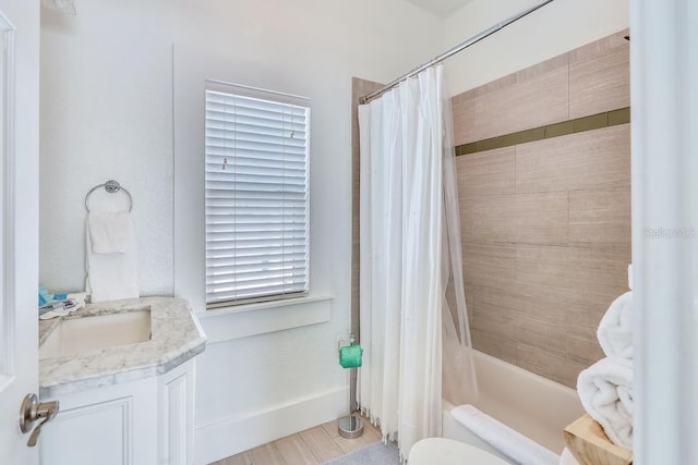 bathroom with vanity and shower / bath combo