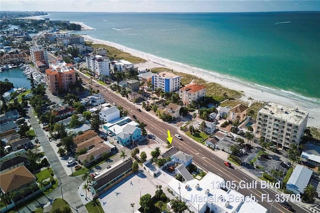 bird's eye view featuring a water view and a view of the beach