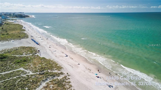 birds eye view of property with a beach view and a water view