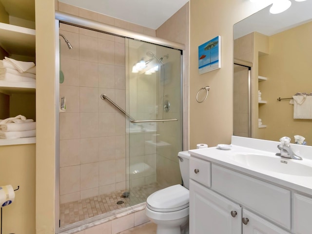 19417 Gulf Blvd Unit B205, Indian Rocks Beach, FL 33785 - bathroom featuring a shower stall, toilet, and vanity