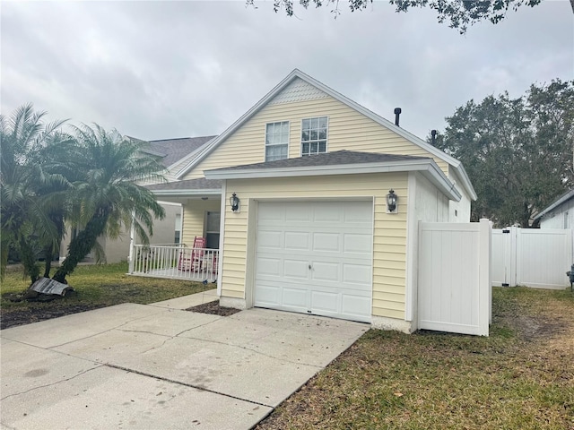 view of front of home featuring a garage and covered porch