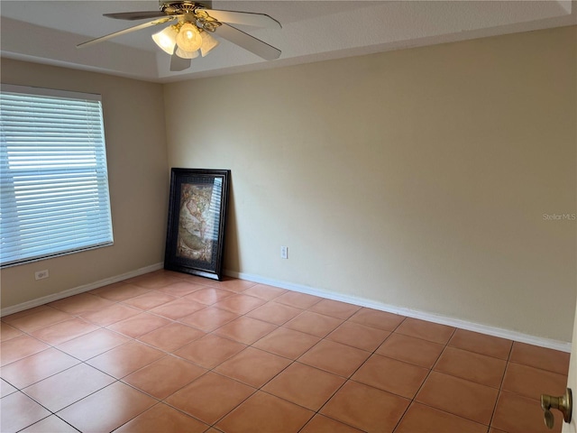 unfurnished room with ceiling fan