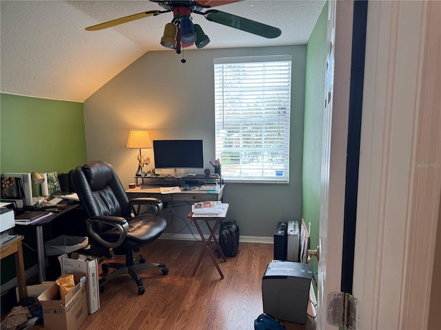 office space with hardwood / wood-style flooring, ceiling fan, vaulted ceiling, and a textured ceiling