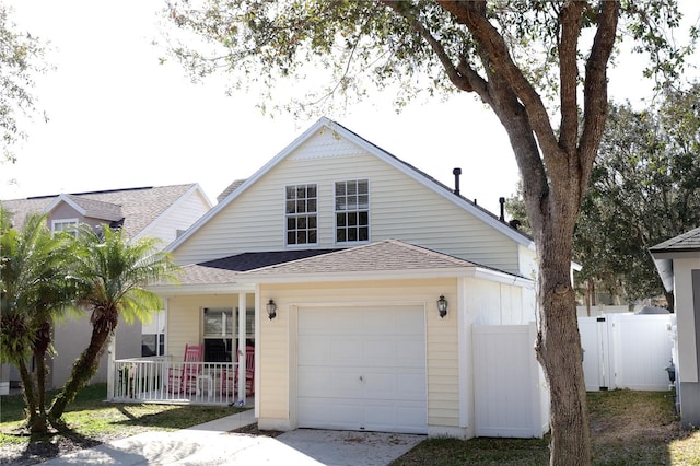 view of front of house featuring a porch and a garage