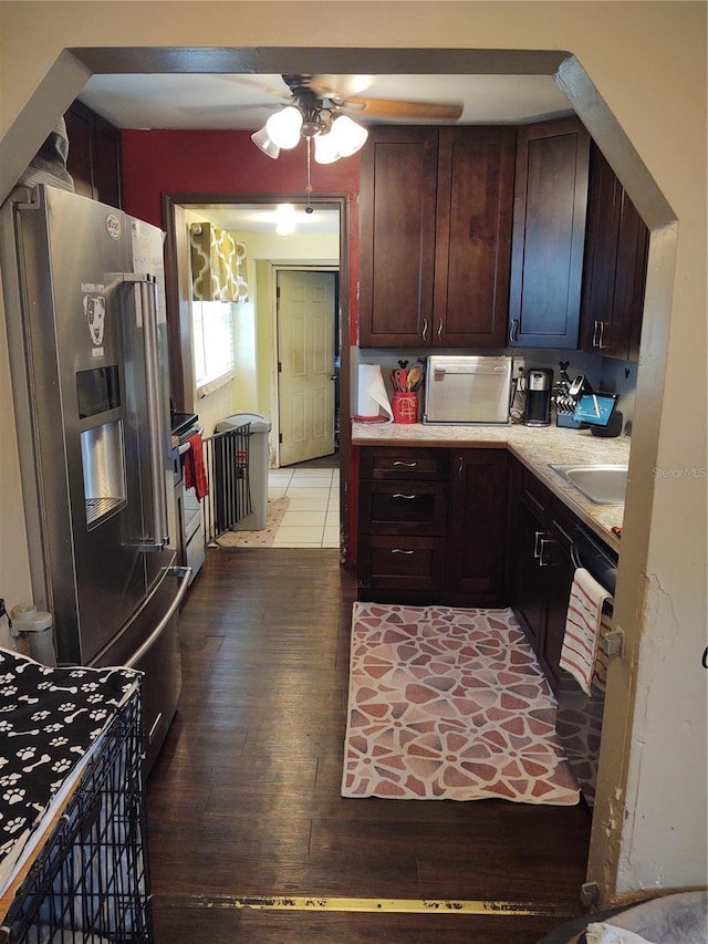 kitchen featuring ceiling fan, high end refrigerator, sink, and light hardwood / wood-style floors