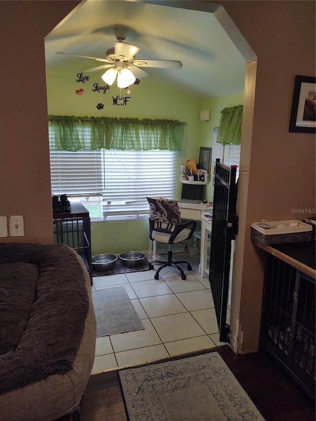 office area with ceiling fan, lofted ceiling, and tile patterned floors