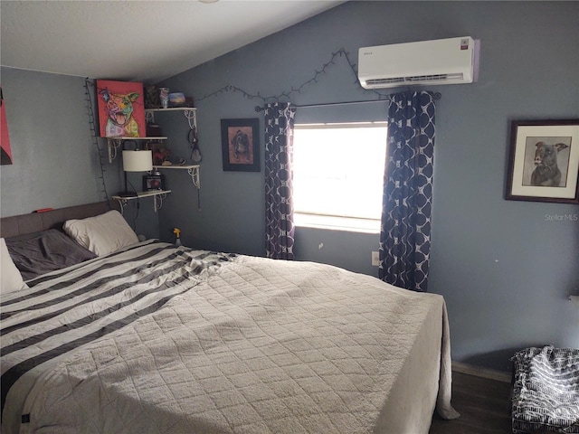 bedroom with hardwood / wood-style flooring, lofted ceiling, and a wall mounted air conditioner