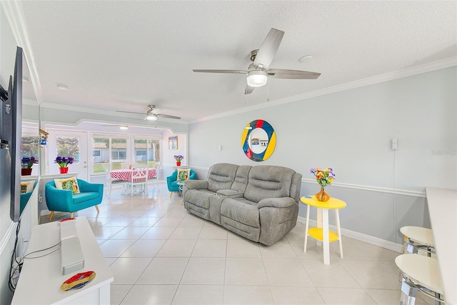 tiled living room with ceiling fan, ornamental molding, and a textured ceiling