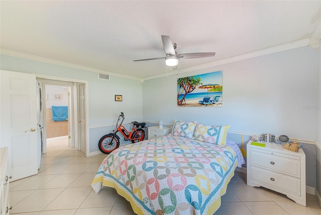 tiled bedroom with crown molding, ceiling fan, and a textured ceiling