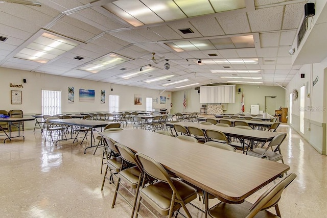 dining area featuring a drop ceiling