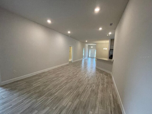 spare room featuring wood-type flooring