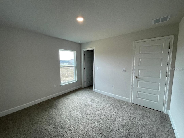 unfurnished bedroom featuring carpet flooring