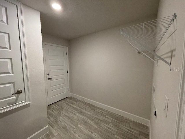 washroom with light wood-type flooring