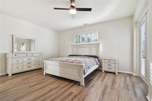 bedroom with ceiling fan and light hardwood / wood-style floors