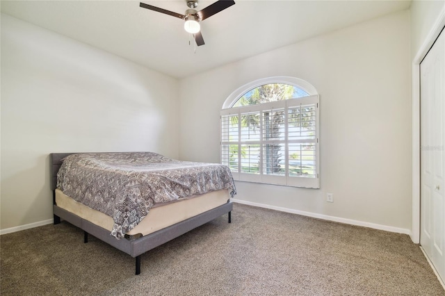 bedroom featuring a closet, ceiling fan, and carpet flooring